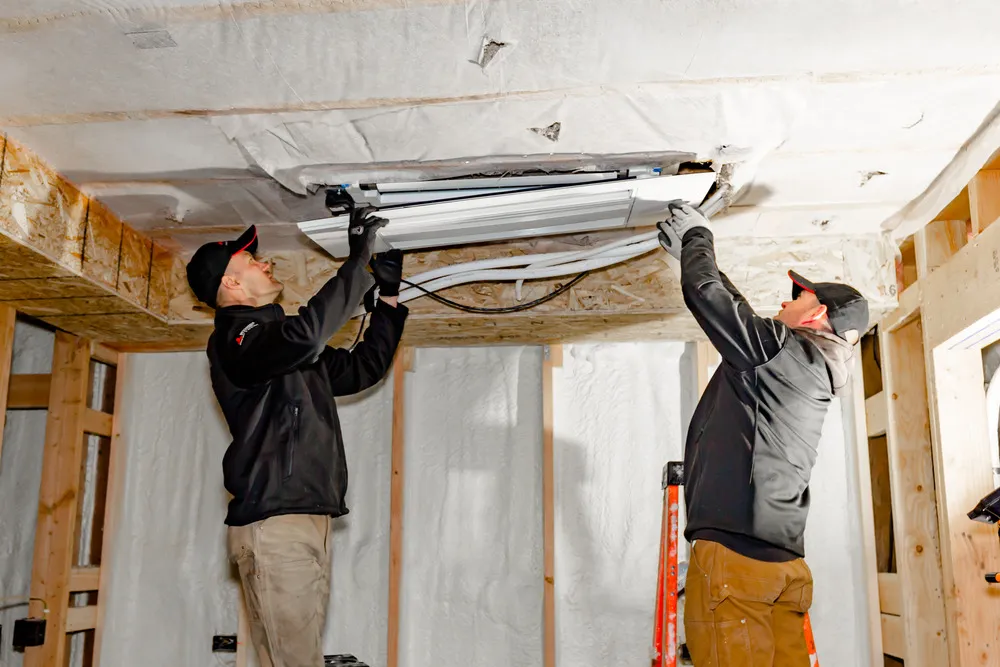 Technician installing HVAC equipment
